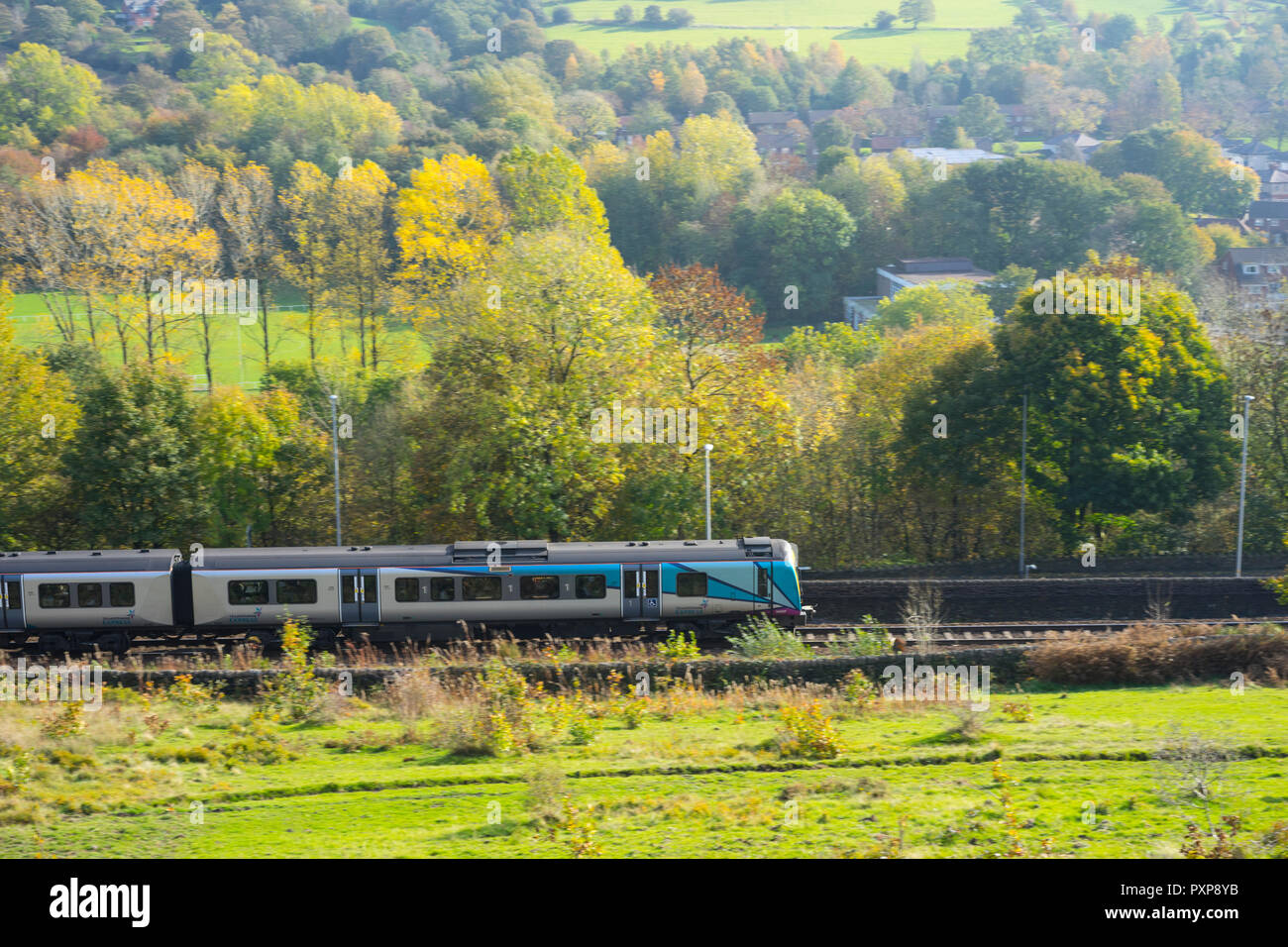 Trans Pennine commuter train passing through Uppermill area heading towards Manchester,Uppermill,Saddleworth, Greater Manchester, UK. Stock Photo