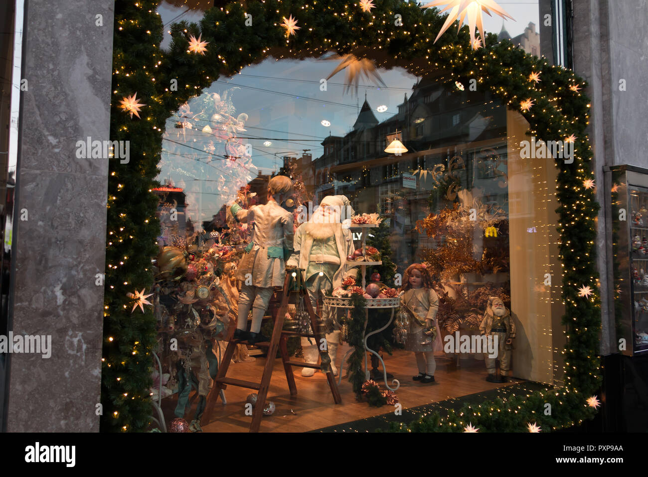 Basel, Switzerland - December 25, 2017: dolls and toys on display in the toy  museum window decorated for Christmas with garlands and balls Stock Photo -  Alamy