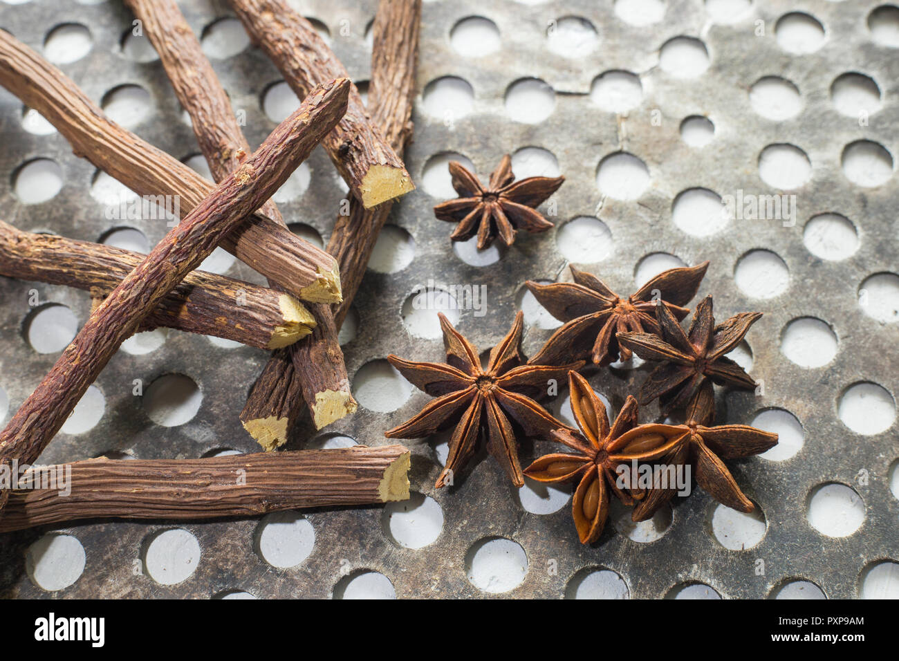 licorice root and anise on the table Glycyrrhiza glabra Stock Photo
