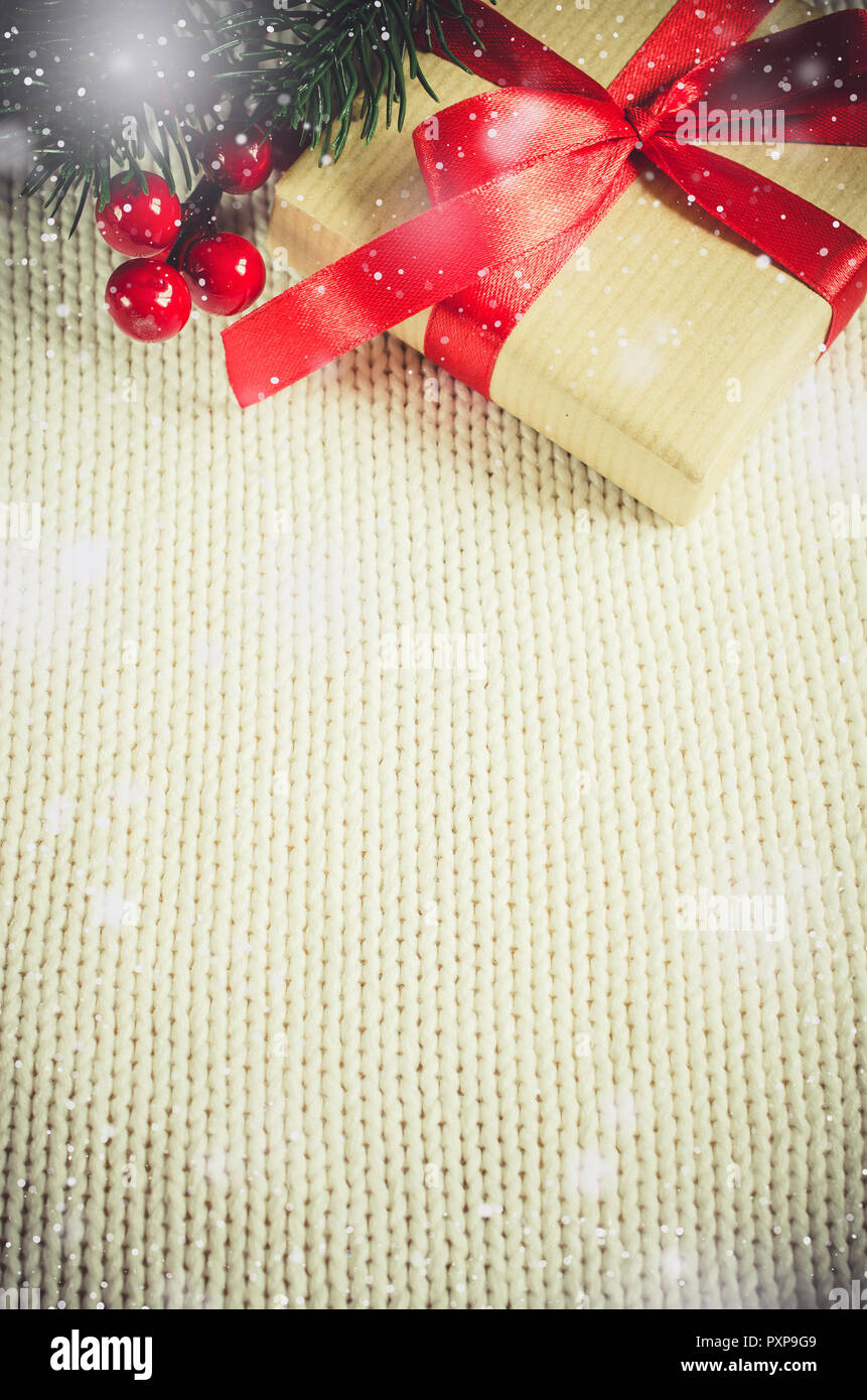Christmas Background With Decorations And Gift Boxes On Knitted