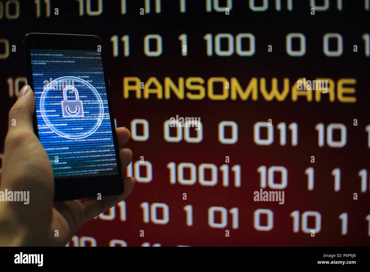 protected in stream of data flow. padlock icon symbolize security and red binary code computer data in the background with ransomware text. Stock Photo