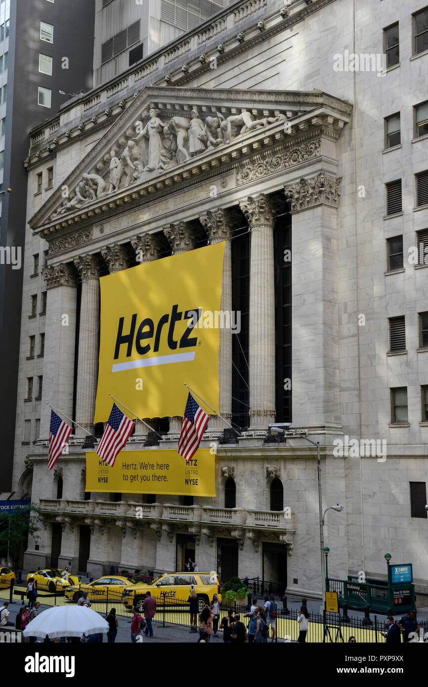 USA, New York City, Manhattan, building of NYSE New York Stock Exchange at Wall Street, banner of car rental company Hertz listed since 1997 / Boerse an der Wall St. Stock Photo