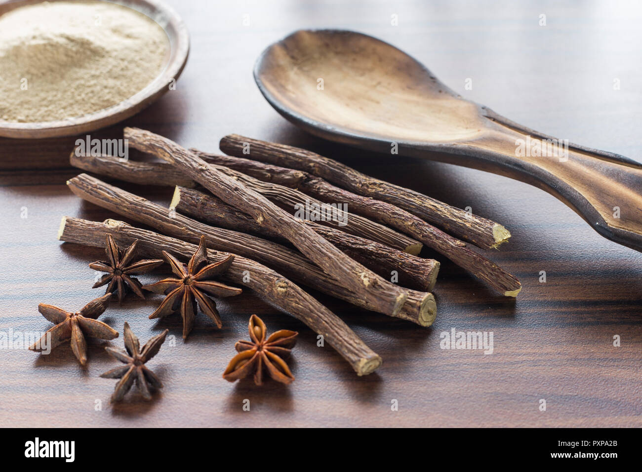 licorice root and anise on the table Glycyrrhiza glabra Stock Photo