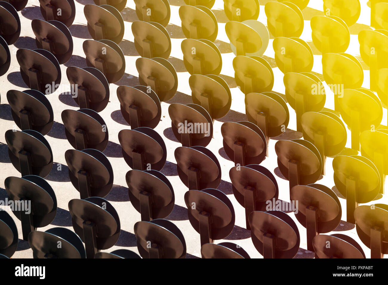 Pattern of round seat folding chairs at outside theatre Stock Photo - Alamy