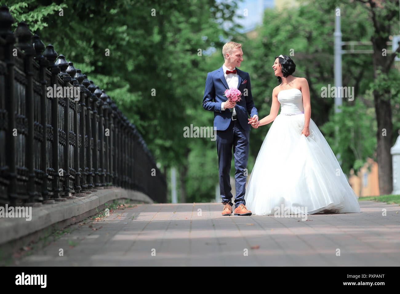 Bride groom walking down street hi-res stock photography and images - Alamy