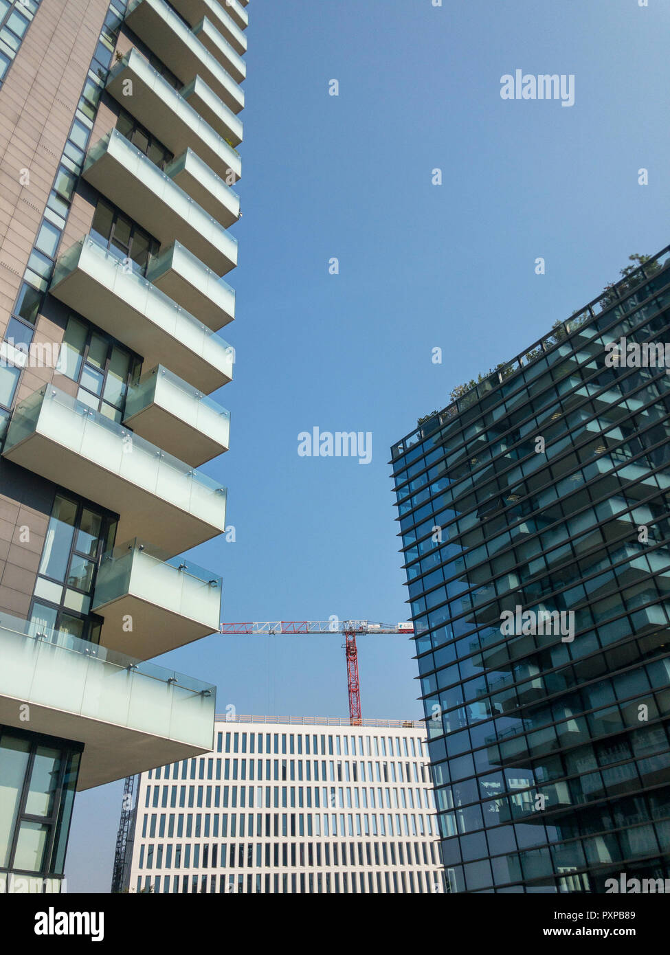 New buildings in Milan, construction sites and residential buildings, the new Milan. City revival, buildings with high energy efficiency. Solaria Stock Photo