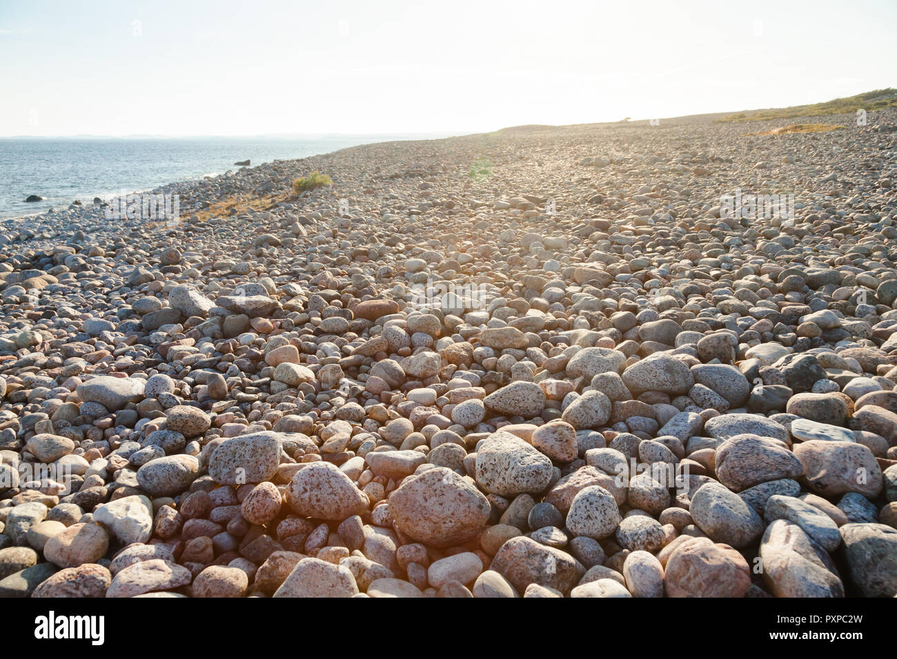 Cobble deposit from the recent ice age or beach of rolling stones at Molen, first UNESCO Global Geopark in the Nordic Countries near Larvik, Vestfold  Stock Photo