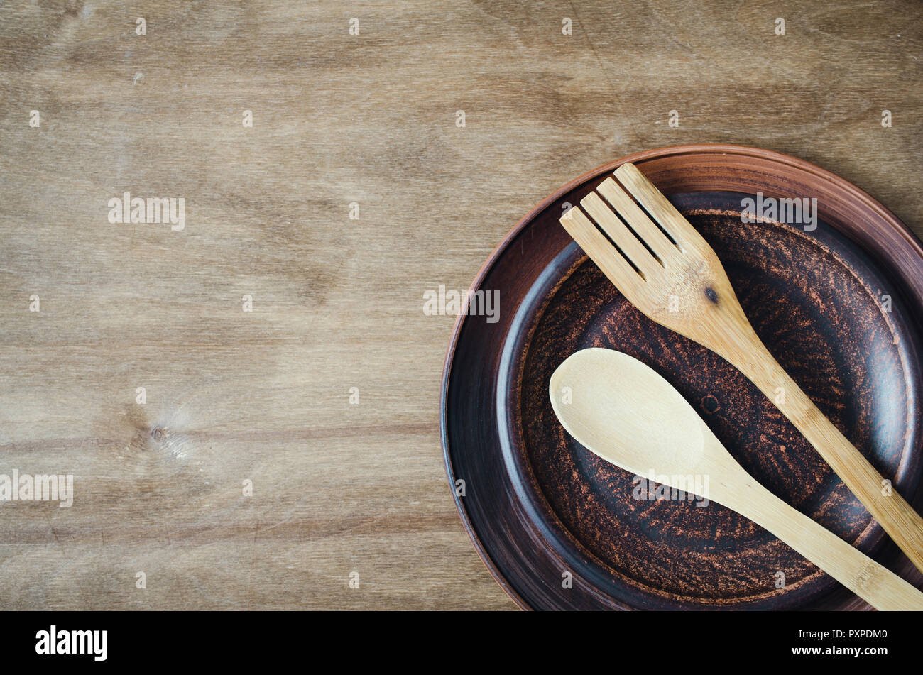 Rustic Kitchen Utensils the Ceramic Plates and Wooden Cutlery on