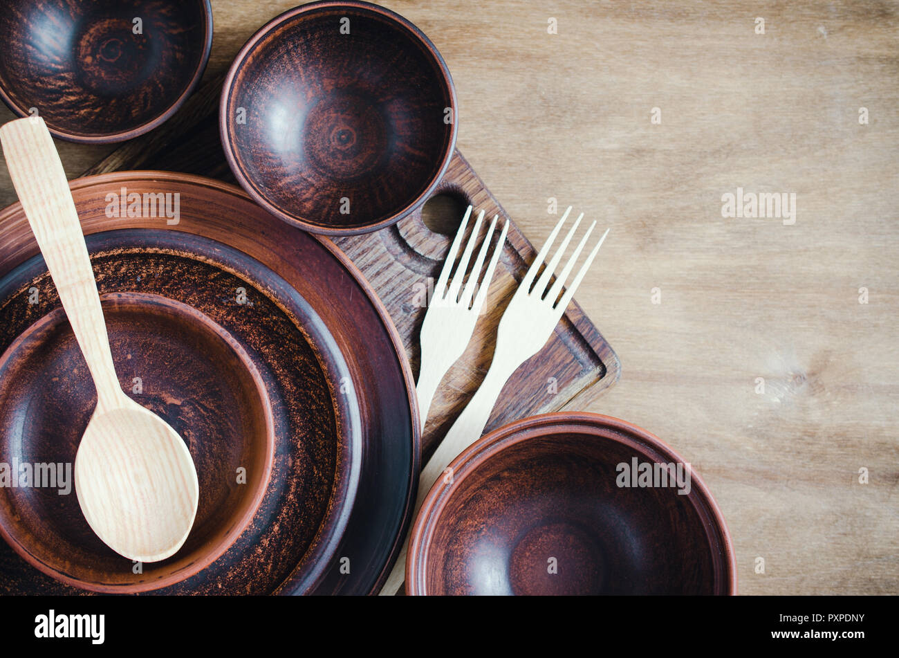 Rustic Kitchen Utensils the Ceramic Plates and Wooden Cutlery on