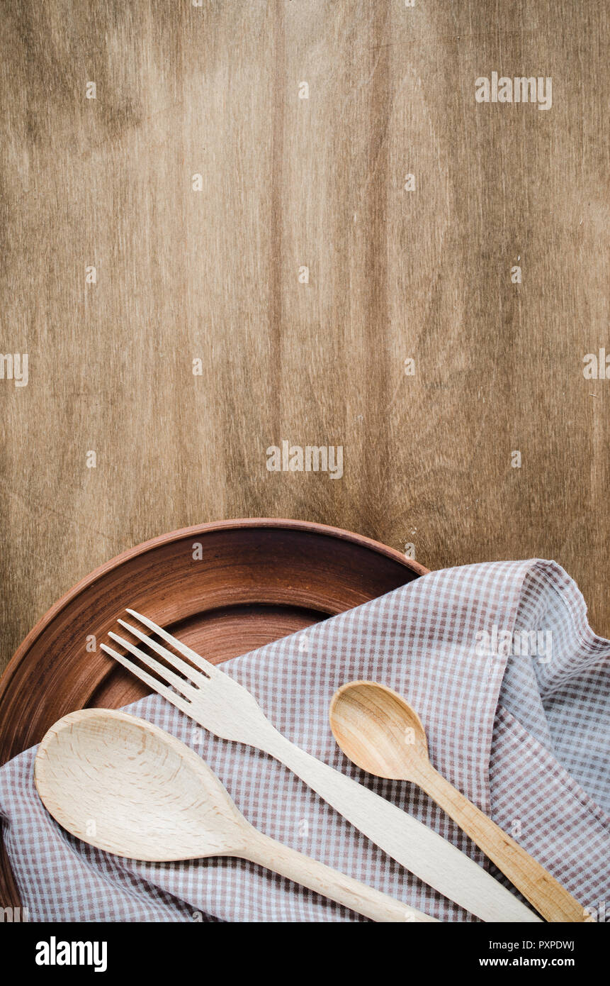 Rustic Kitchen Utensils the Ceramic Plates and Wooden Cutlery on