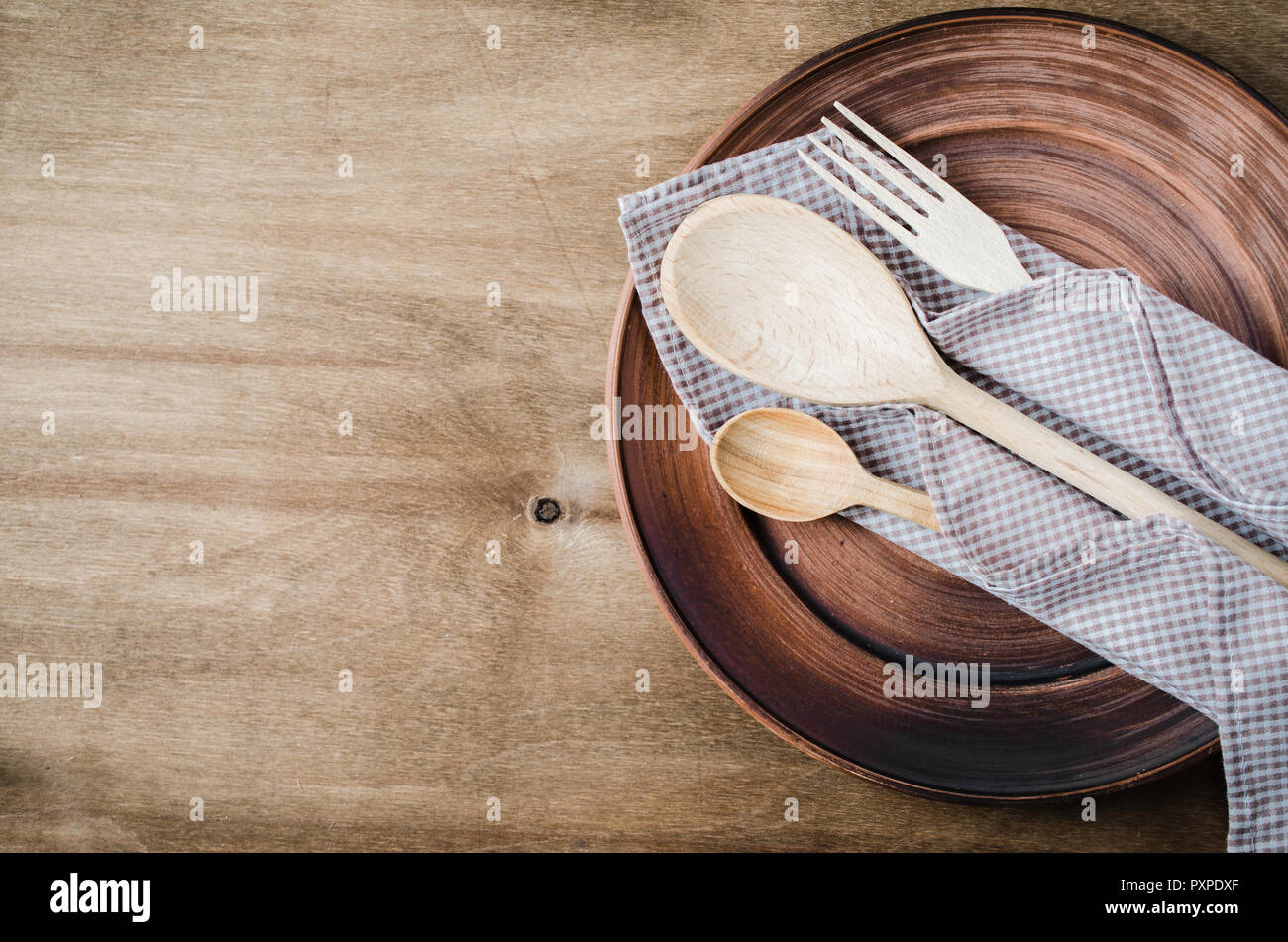 Rustic Kitchen Utensils: the Ceramic Plates and Wooden Cutlery on Wooden  Background. Home Wares. Kitchen Decor in Rustic Style. View From Above With  C Stock Photo - Alamy
