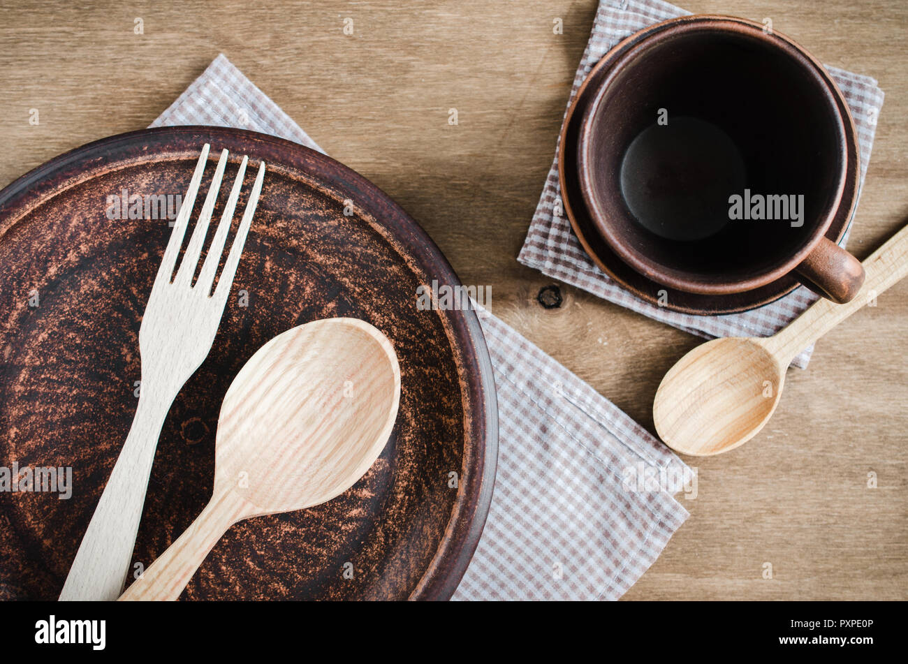 Rustic Kitchen Utensils the Ceramic Plates and Wooden Cutlery on