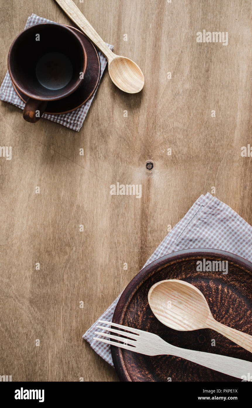 Rustic Kitchen Utensils the Ceramic Plates and Wooden Cutlery on