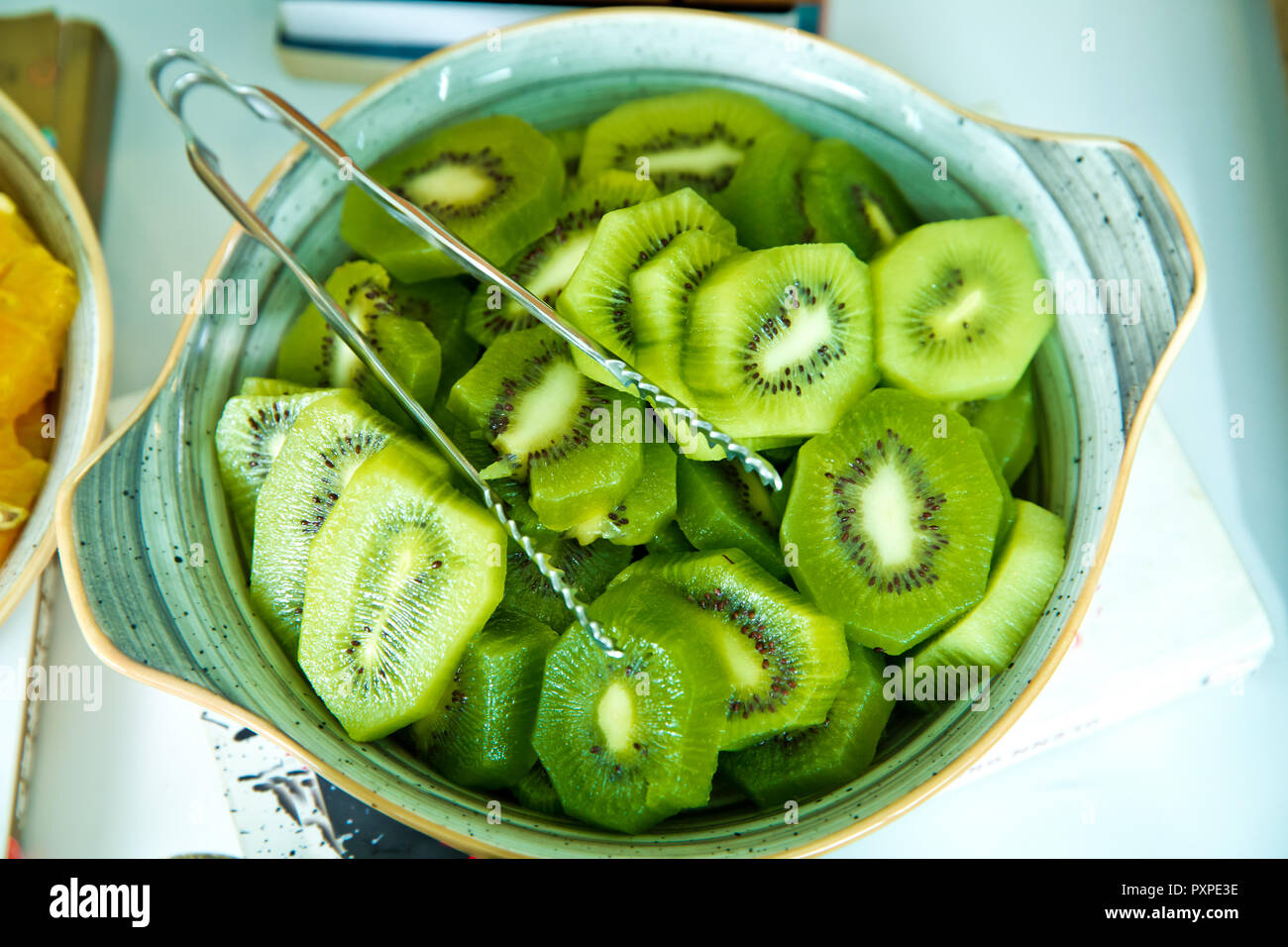 Cut of the monkey peach . Compote of Pineapple and Fresh Kiwi in Glass Bowl Stock Photo Alamy