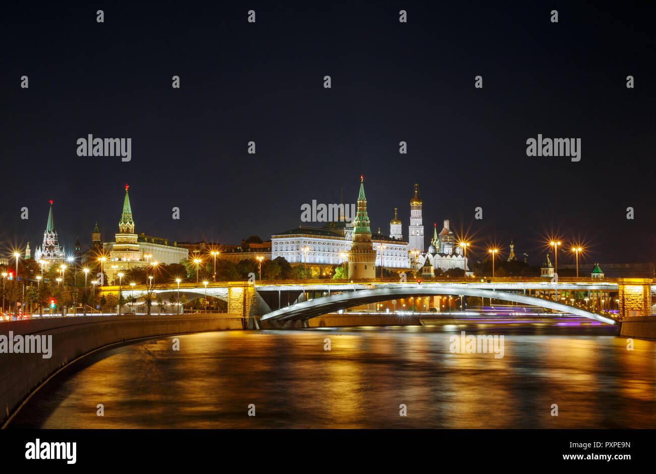 sight of Moscow Kremlin and Bolshoy Kamenny Bridge on Moskva River at night Stock Photo
