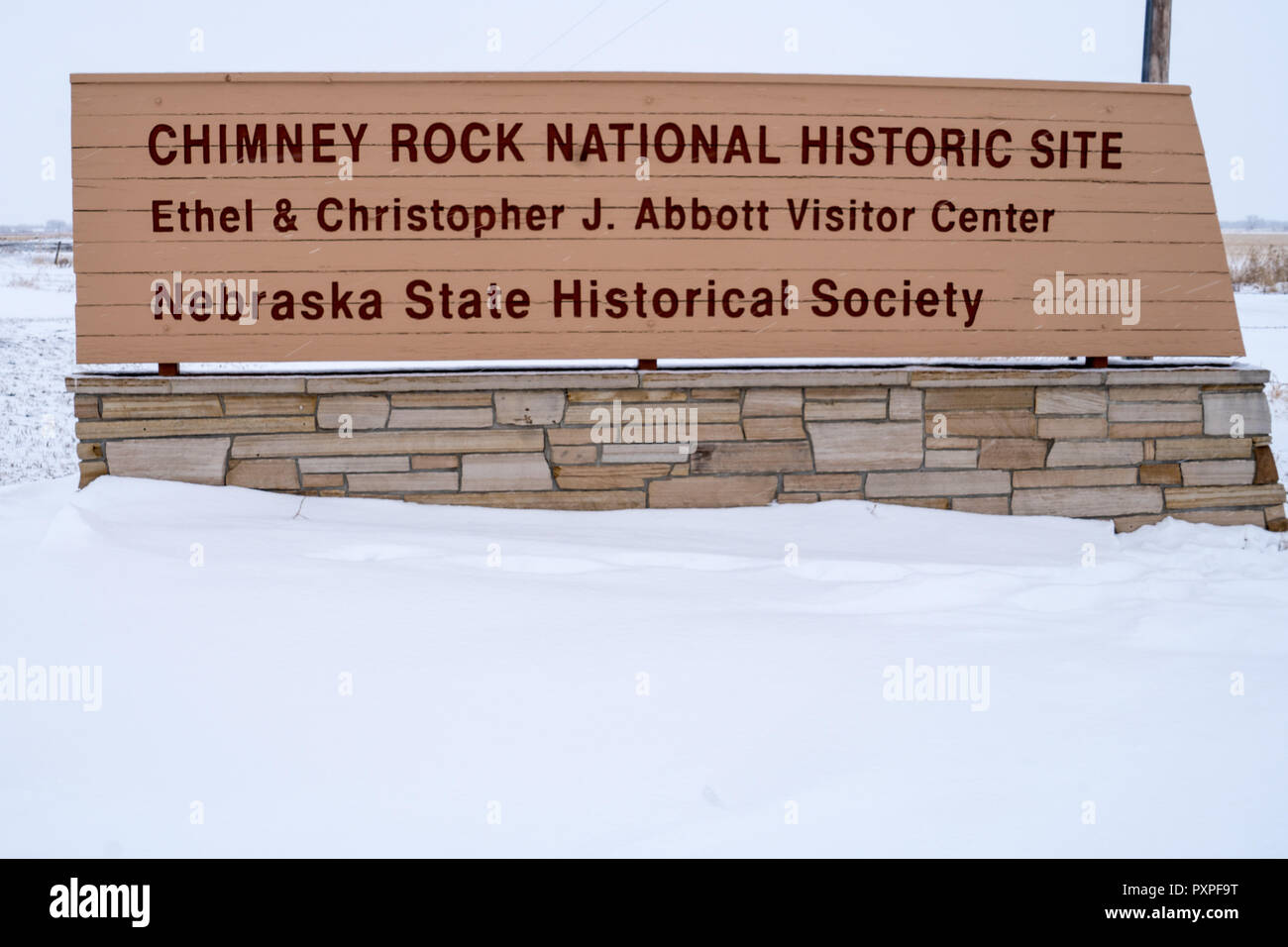 DECEMBER 31 2017 - BAYARD, NE: The Chimney Rock National Historic Site Visitors center during a winter snowstorm. Inside is a museum explaining the ro Stock Photo