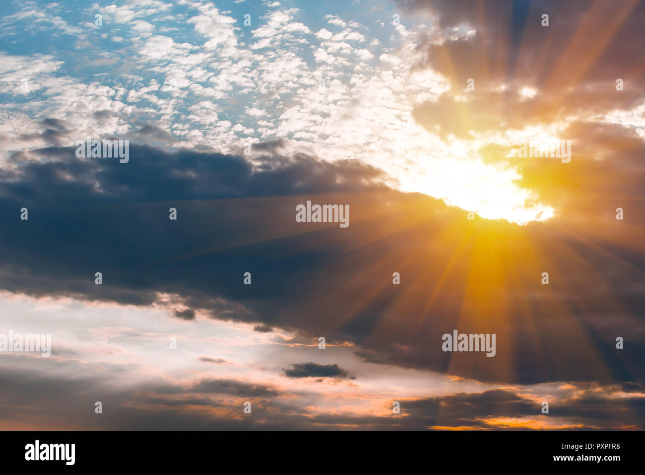 beautiful bright sunset in the cloudy sky Stock Photo - Alamy
