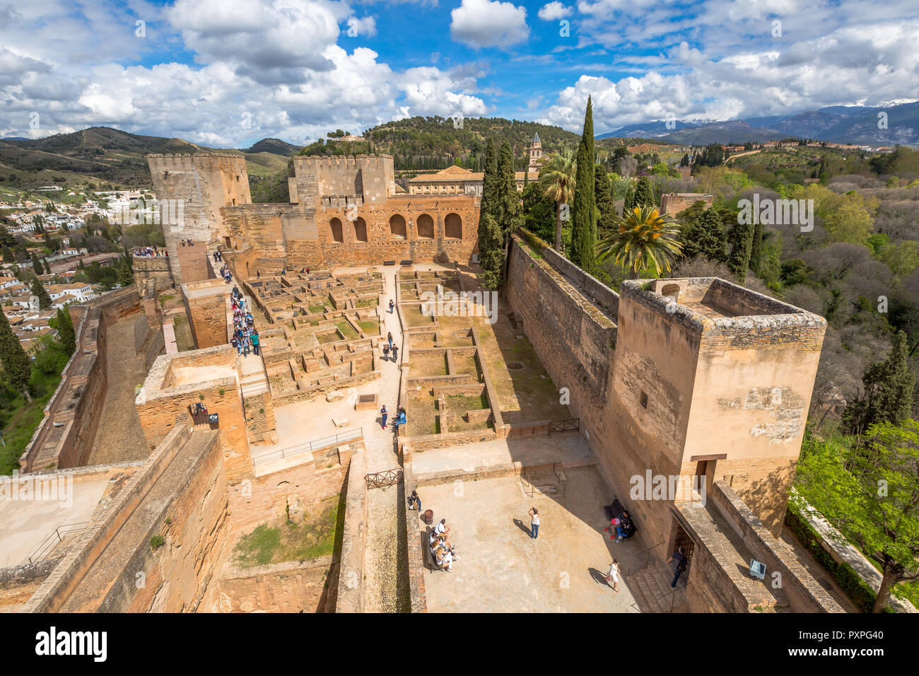 Granada, Spain - April 17, 2016: aerial view of people and tourists visiting the Alcazaba de Granada, the military fortress of Alhambra, one of the most visited attractions of Andalusia. Stock Photo