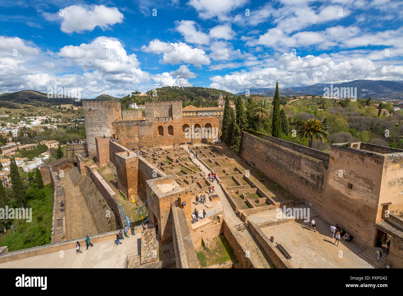 Alhambra de Granada, Spain - April 17, 2016: people and tourists visiting the Alcazaba de Granada, one of the most visited attractions of Andalusia. Aerial view from the tower of fortress. Stock Photo