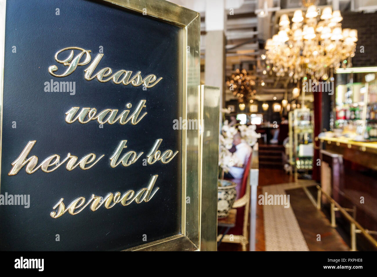 London England,UK,Piccadilly Mayfair,Caffe Concerto Piccadilly,restaurant restaurants food dining cafe cafes,Italian,entrance,host sign,wait to be ser Stock Photo