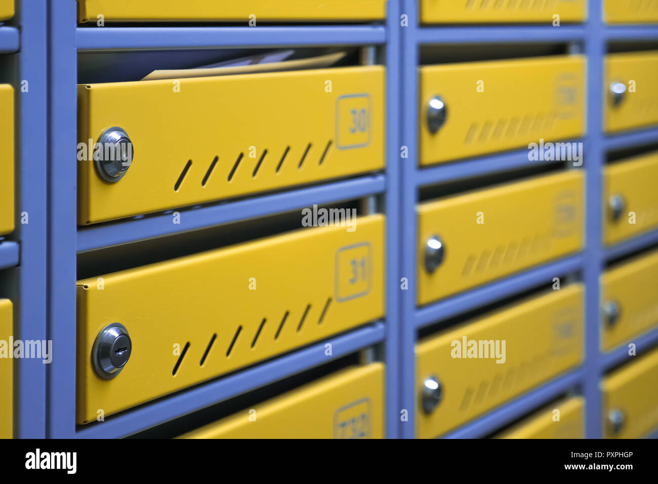 Metal mailboxes in an apartment building. Mailboxes background. Stock Photo