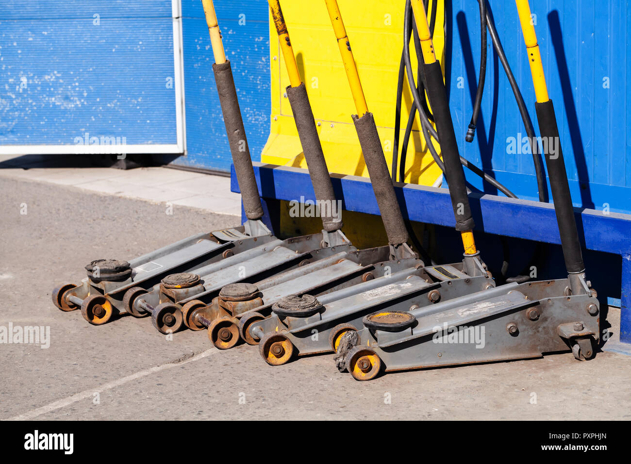 Wheel Replacement Tools Jacks Stand In The Line Near Garage
