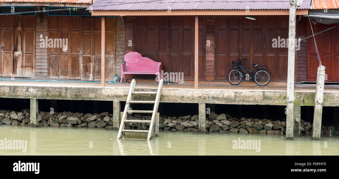 Black bicycle and pink bench at empty floating market Stock Photo
