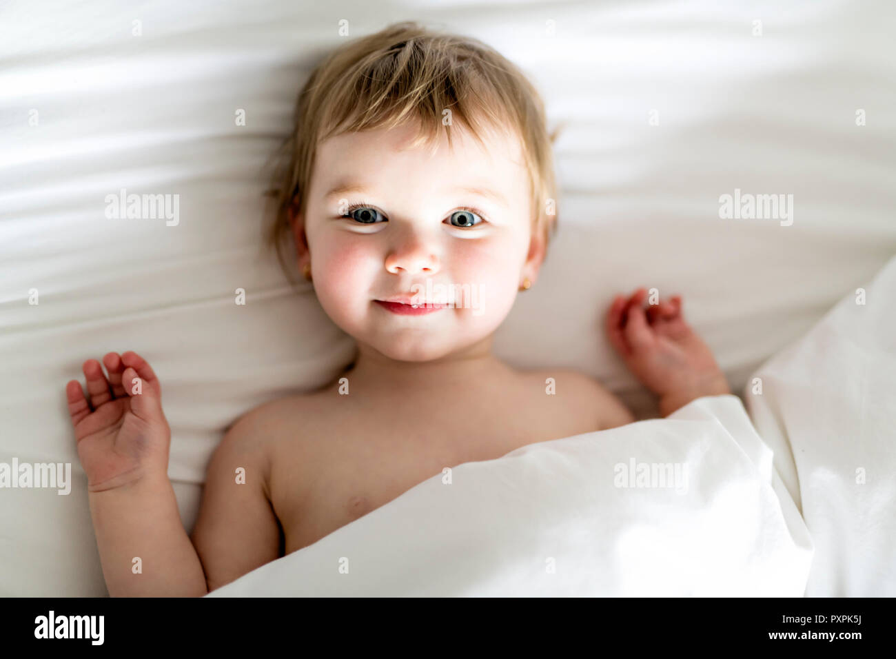 one years girl baby on the bed Stock Photo Alamy