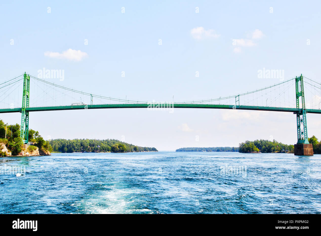 Constructed in 1937, the Thousand Islands International Bridge spans over the St. Lawrence River connecting New York, USA, with Ontario, Canada in the Stock Photo