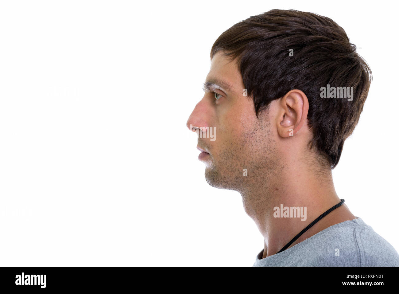 Close up profile view of young handsome man Stock Photo