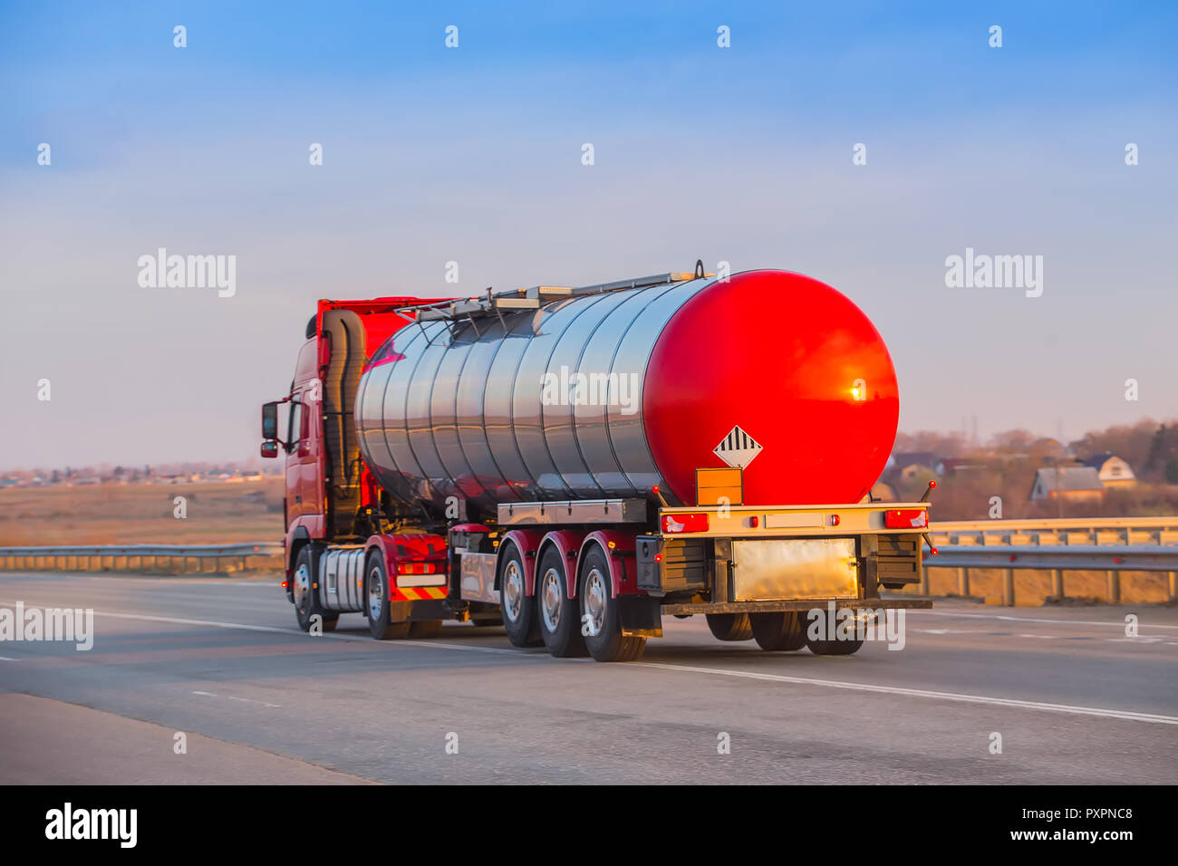 big fuel truck goes on the country highway Stock Photo