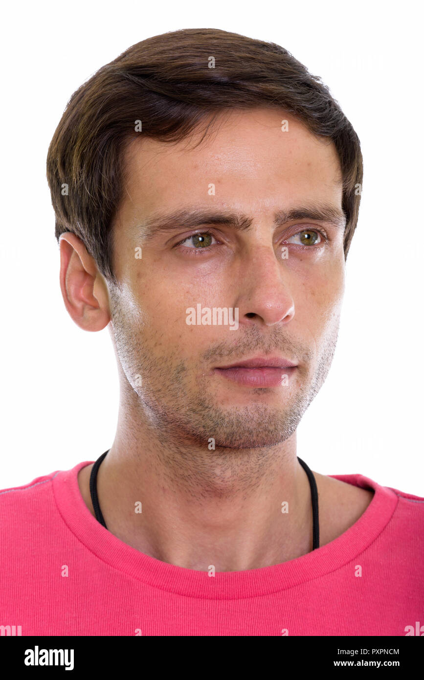 Face of young handsome man thinking while looking at distance  Stock Photo