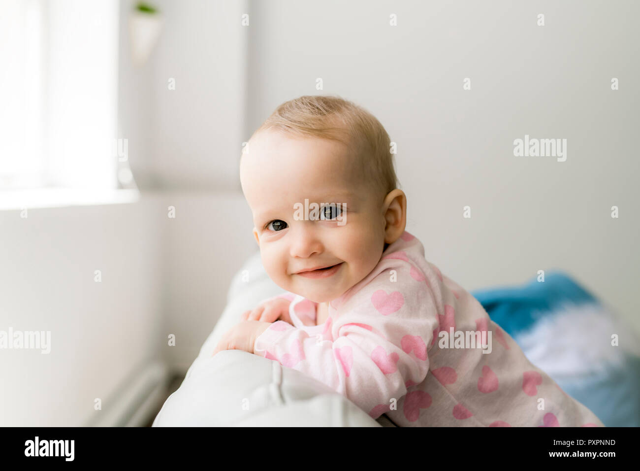 Cute baby in couch Stock Photo Alamy