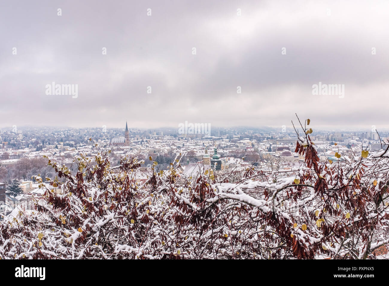 View from Schlossberg in Graz to Herz-Jesu-Church with some snow in winter Stock Photo