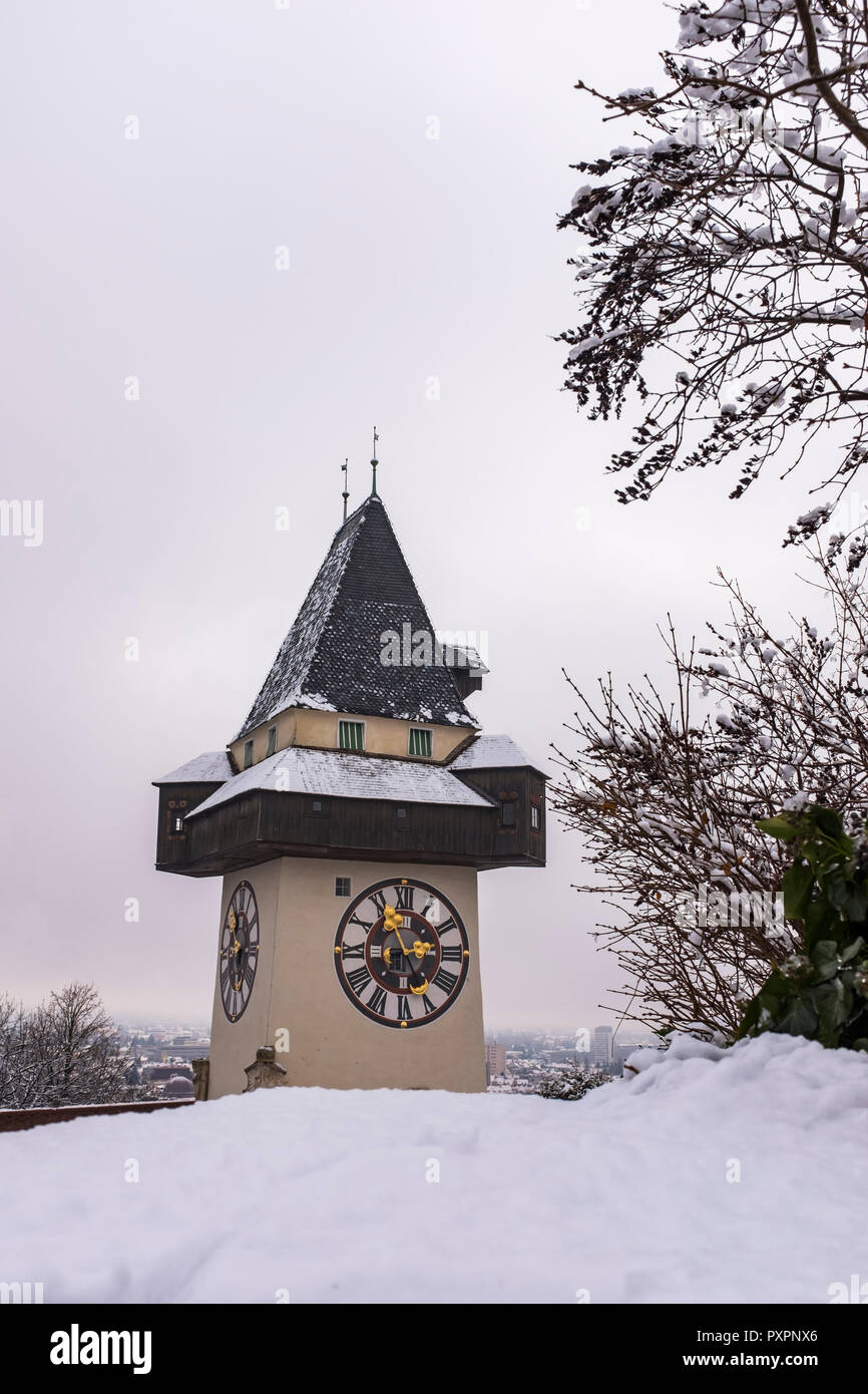Landmark Uhrturm on hill Schlossberg in Graz on a snowy winterday Stock Photo