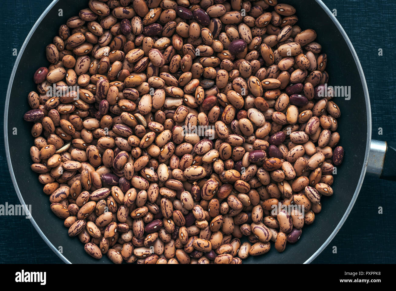 Pinto bean in pan from above, top view of healthy legume beans Stock