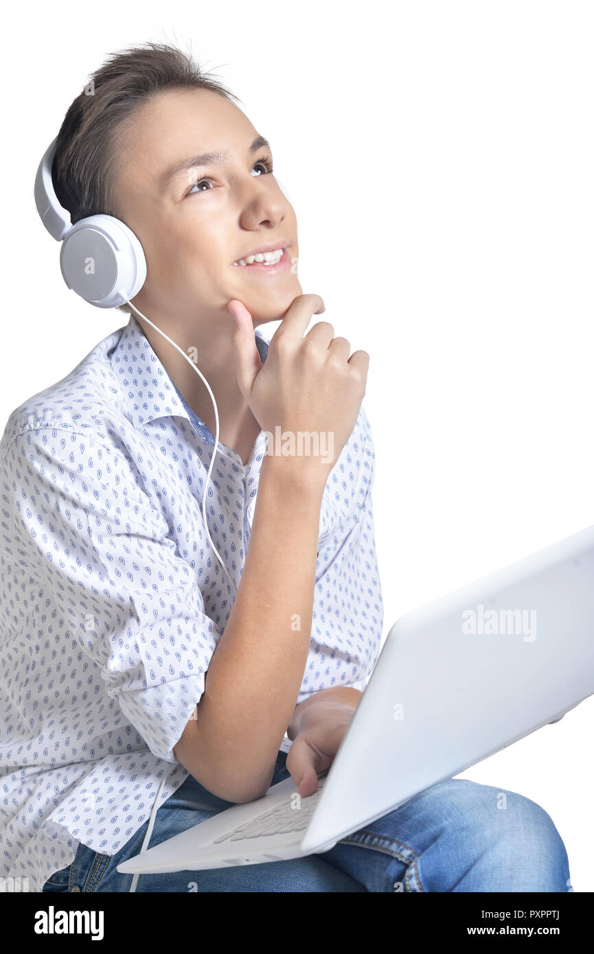 Portrait of teenage boy using laptop isolated on white background Stock ...