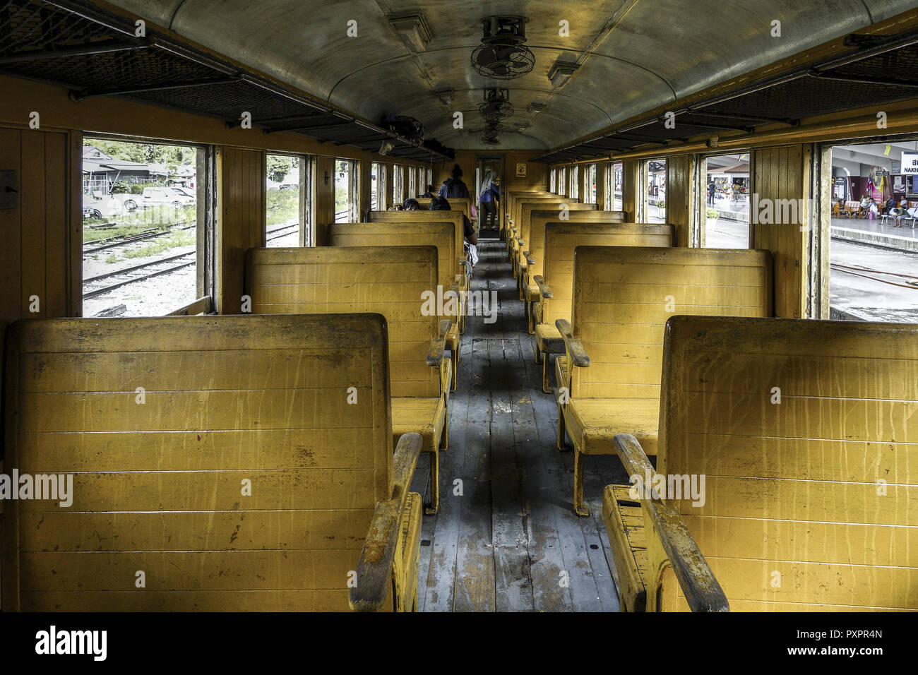 Old Train Passenger Carriage With Wooden Bench Seat Stock Photo