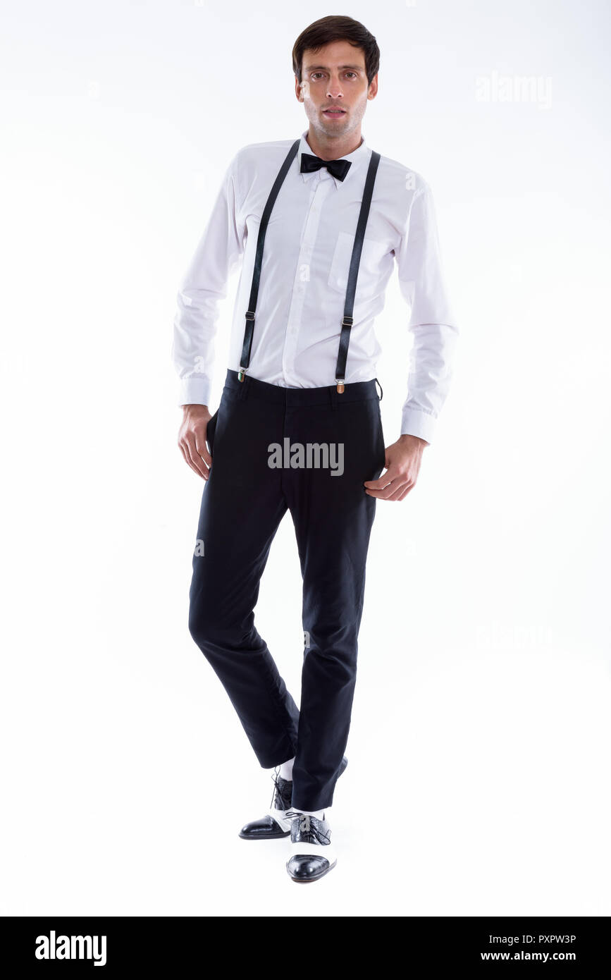 Full body shot of young handsome man posing while wearing suspen Stock ...