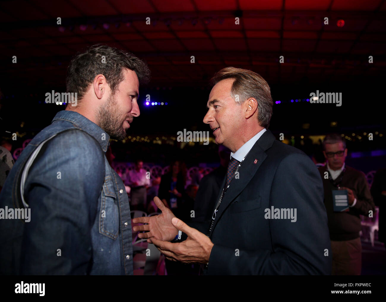 Mark Cavendish talks to Mario Molteni in hospitality during day one of the Six Day Series at Lee Valley Velopark, London. Stock Photo