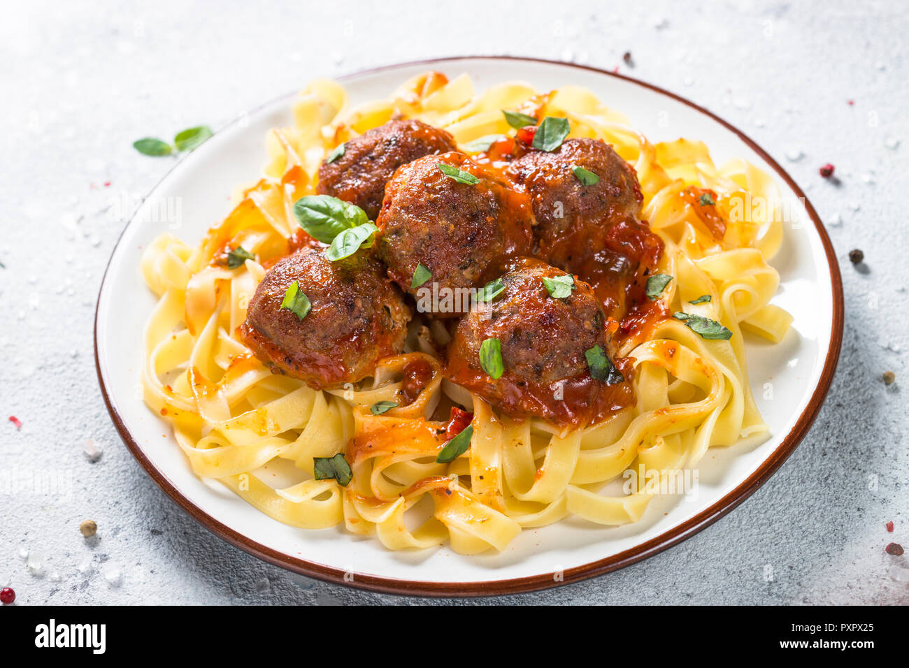 Meatballs in tomato sauce with pasta tagliatelle Stock Photo Alamy