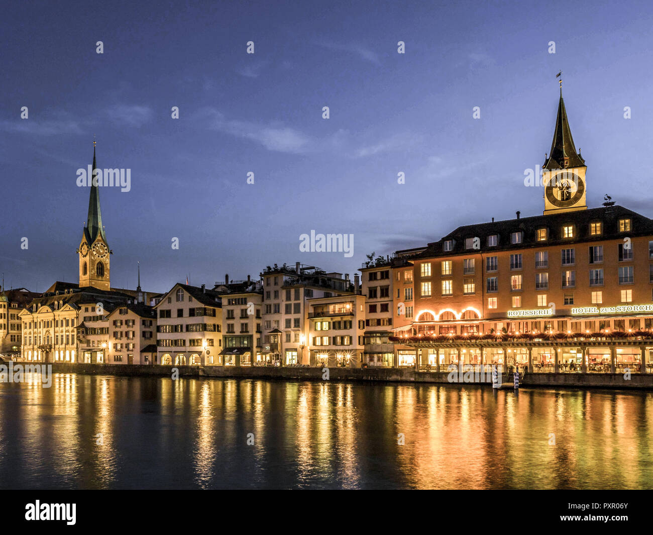 Frauenmunster Abbey and St. Peters Church in Zurich at night, Switzerland, Europe Stock Photo