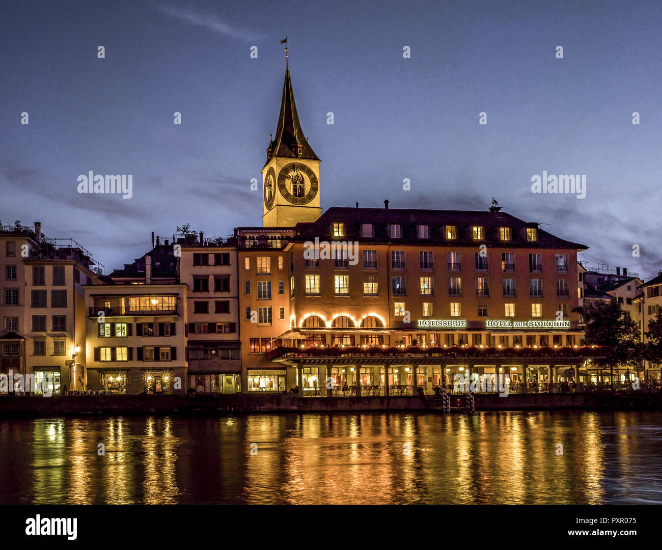 St. Peters Church and Hotel zum Storchen in Zurich at night, Switzerland, Europe. Stock Photo