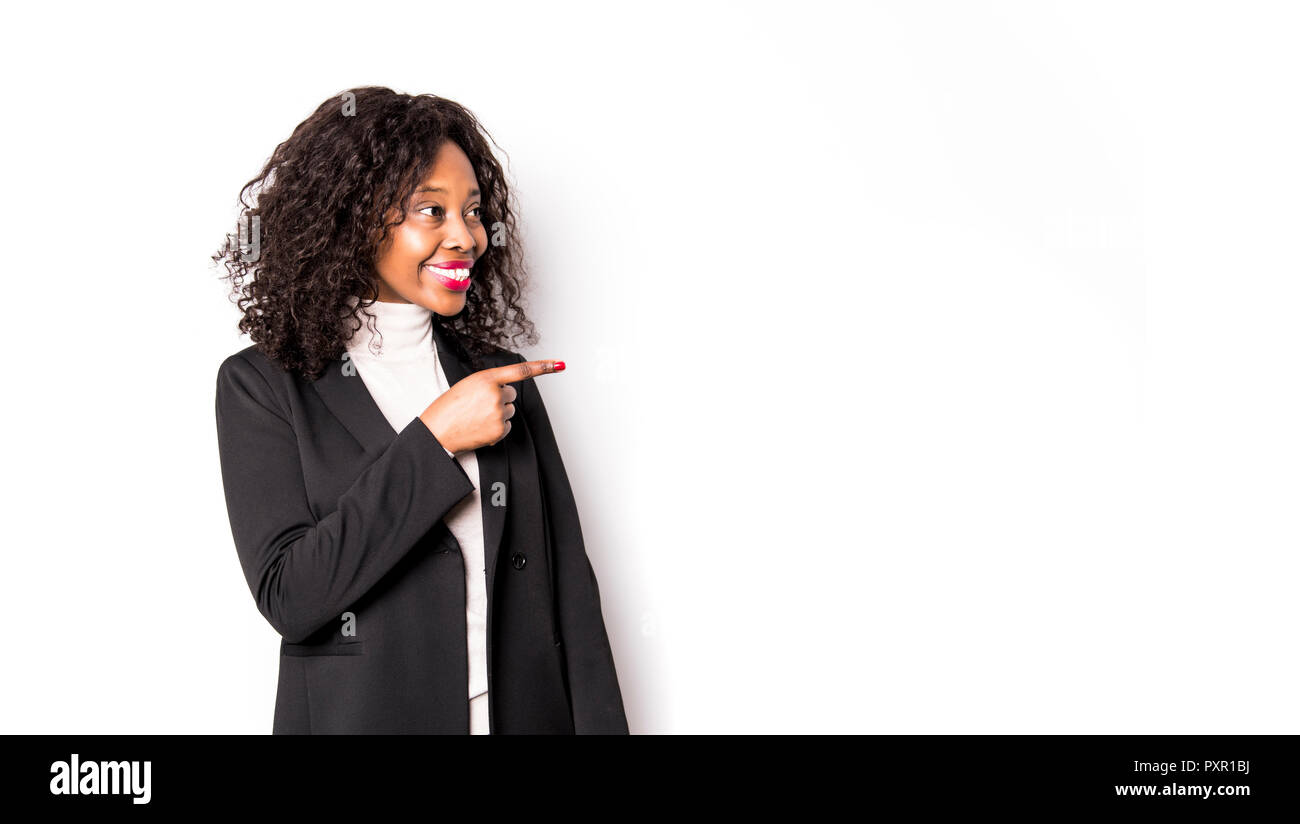 A black business woman poses for a portrait on studio white Stock Photo ...