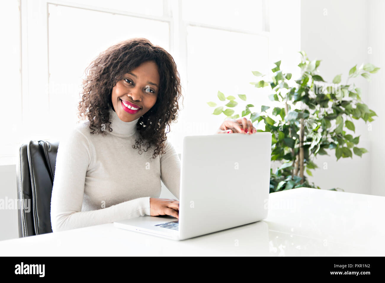 Beautiful black woman working on self employee office Stock Photo - Alamy
