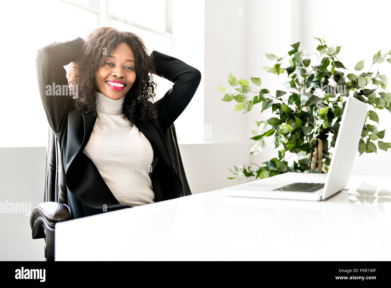 Beautiful black woman working on self employee office Stock Photo - Alamy