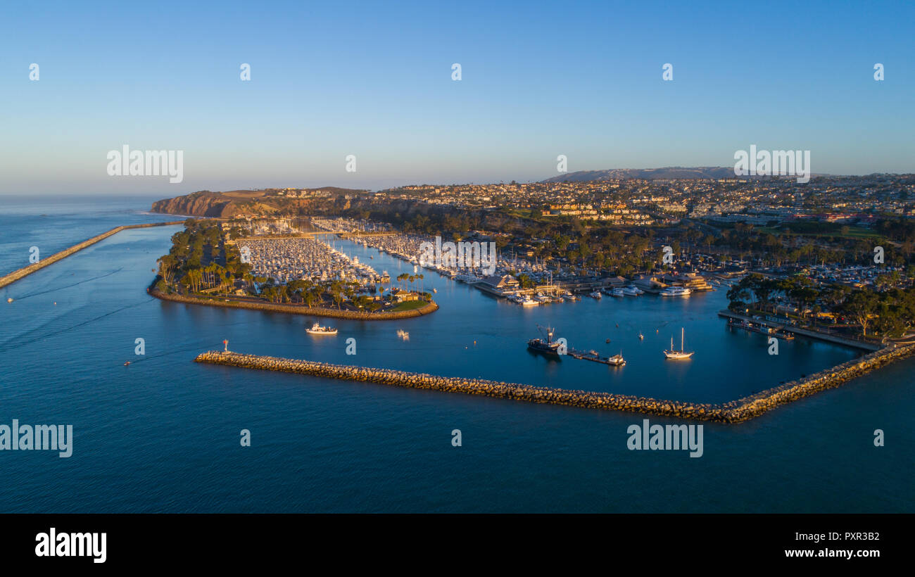 Doheny state beach, drone image of Dana Point Harbor Sunrise In October.  Beautiful sunrise aerial shots of Boats in the harbor. Drone photography. Stock Photo