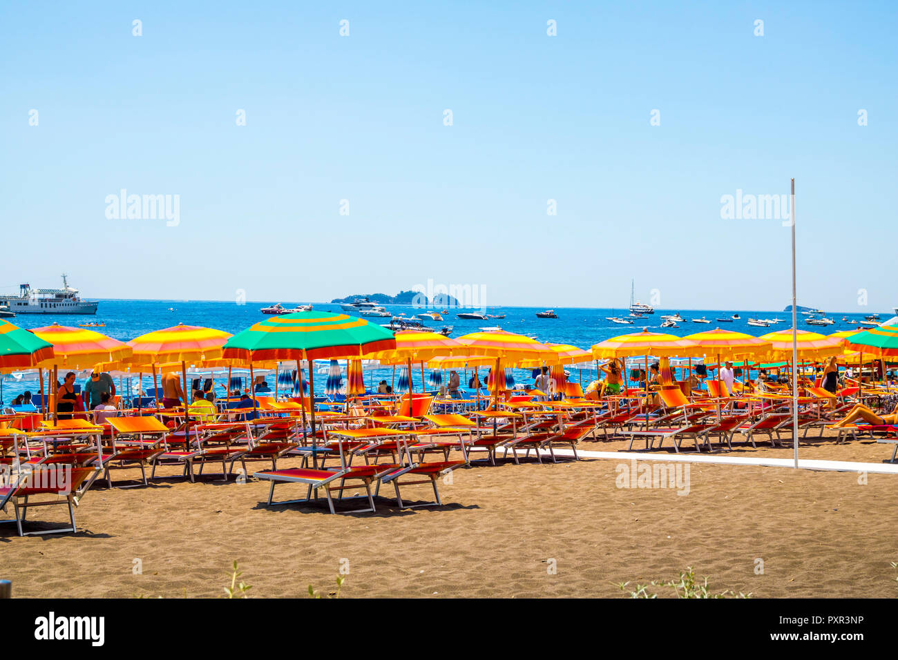 Colourful parasol multicoloured umbrellas lounger beach beds, stripe