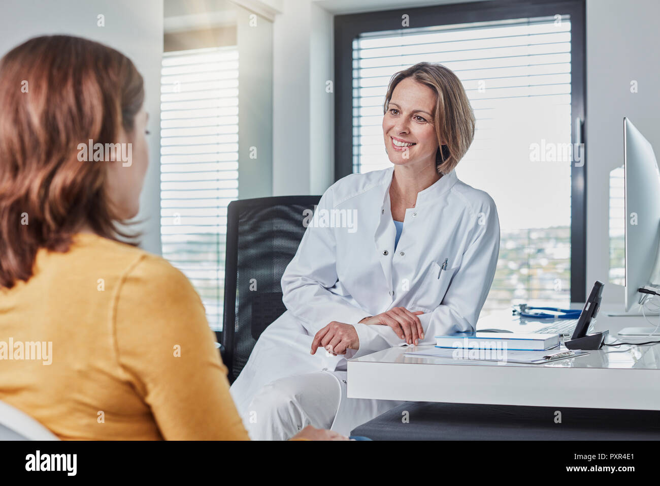 Physician patient talk Stock Photo