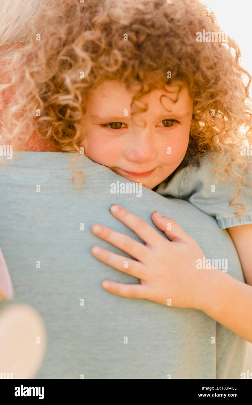 Portrait of little girl cuddling her uncle Stock Photo